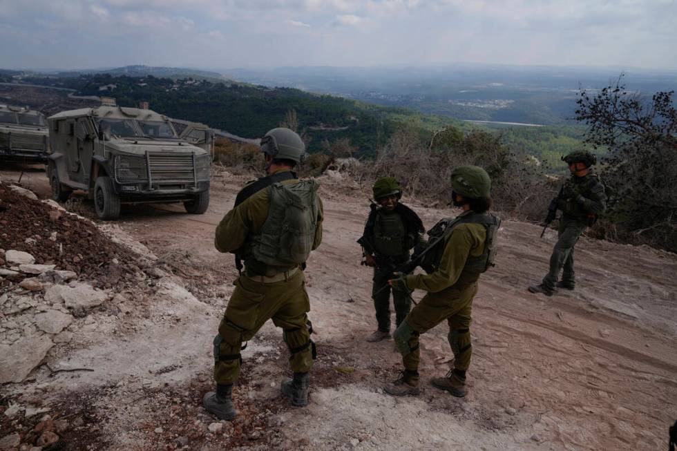 Israeli soldiers are seen during a ground operation in southern Lebanon, near the border with I ...