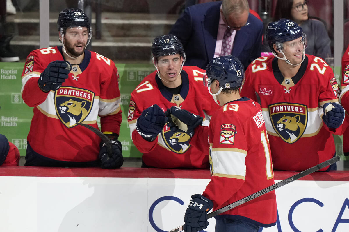 Florida Panthers center Sam Reinhart (13) is congratulated by teammates after he scored during ...