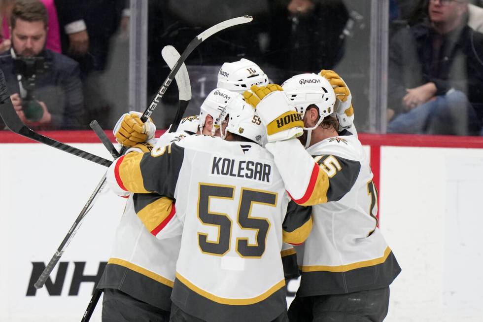 Vegas Golden Knights right wing Keegan Kolesar (55) is congratulated by teammates after he scor ...