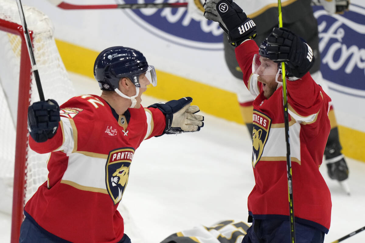 Florida Panthers defenseman Gustav Forsling, left, celebrates with center Sam Bennett after For ...