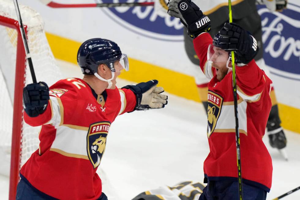 Florida Panthers defenseman Gustav Forsling, left, celebrates with center Sam Bennett after For ...