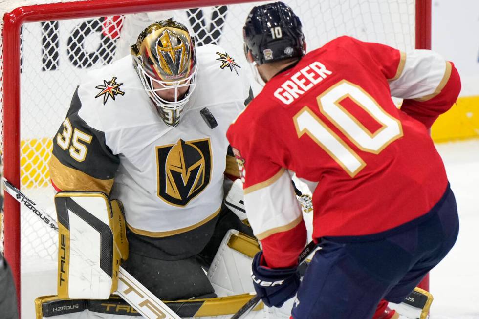 Florida Panthers left wing A.J. Greer (10) attempts a shot at Vegas Golden Knights goaltender I ...