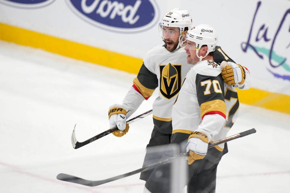 Vegas Golden Knights center Nicolas Roy, left, celebrates with left wing Tanner Pearson (70) af ...