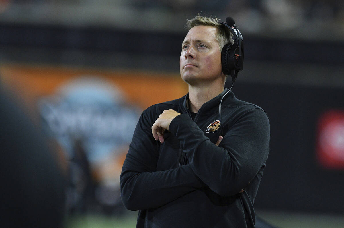 Oregon State head coach Trent Bray checks the score board while playing UNLV in the second half ...