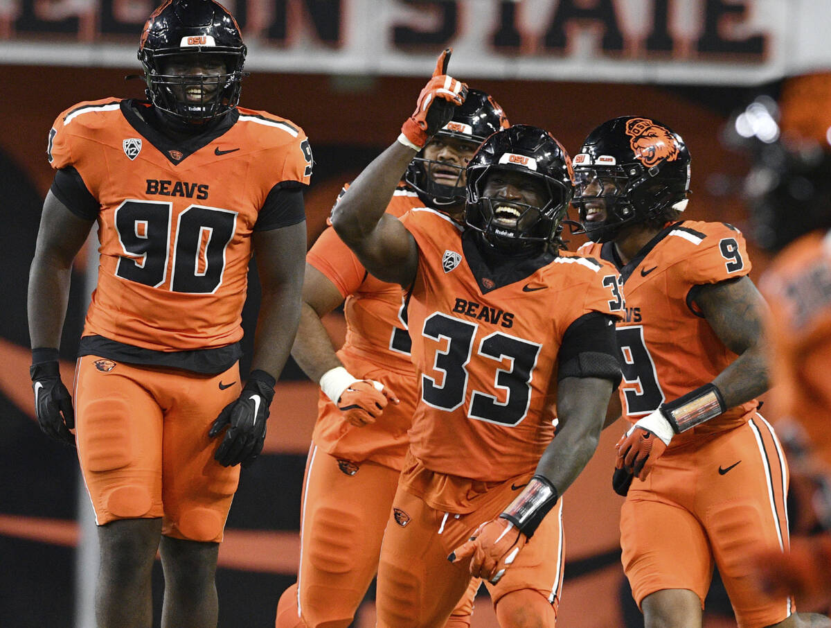 Oregon State linebacker Oluwaseyi Omotosho (33) celebrates a sack against UNLV during the secon ...