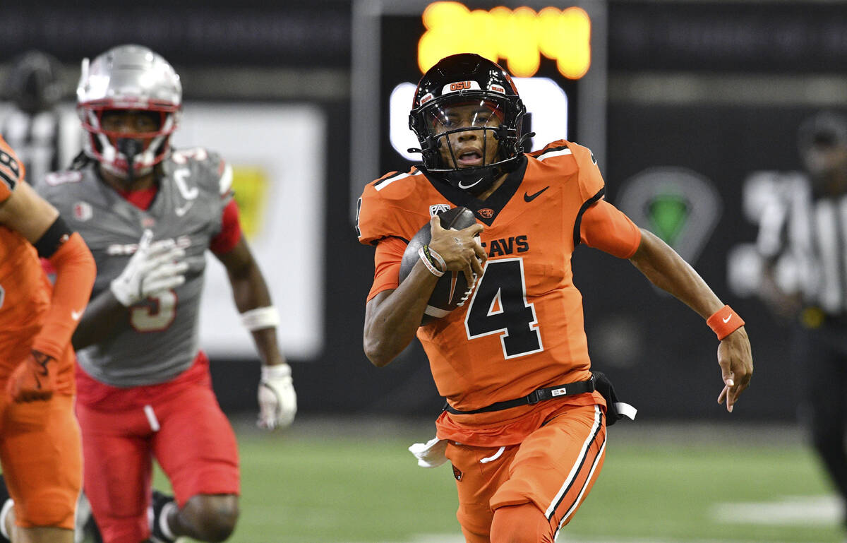 Oregon State quarterback Gevani McCoy (4) rushes for his second touchdown against UNLV during t ...