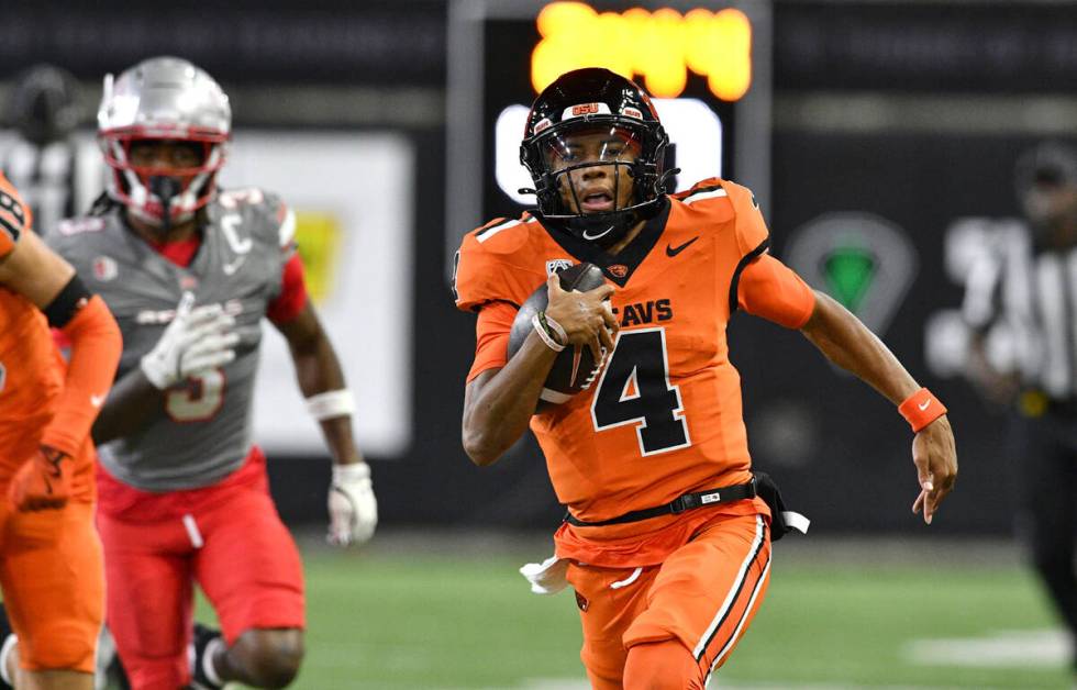 Oregon State quarterback Gevani McCoy (4) rushes for his second touchdown against UNLV during t ...