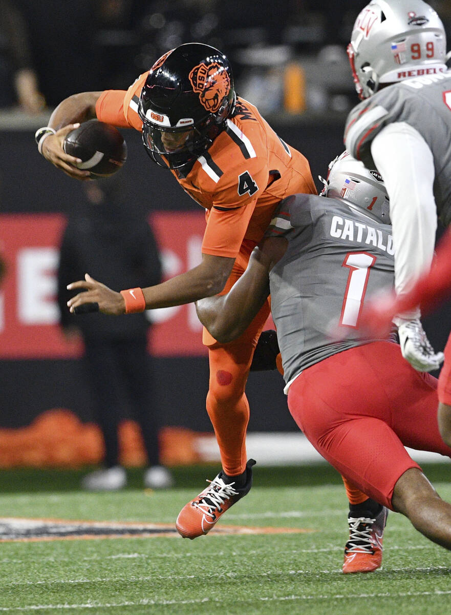 UNLV defensive back Jalen Catalon (1) sacks Oregon State quarterback Gevani McCoy (4) during th ...