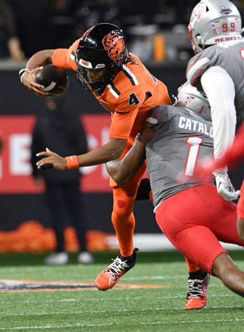 UNLV defensive back Jalen Catalon (1) sacks Oregon State quarterback Gevani McCoy (4) during th ...