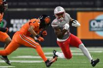 UNLV running back Kylin James (20) rushes in front of Oregon State defensive back Mason White ( ...