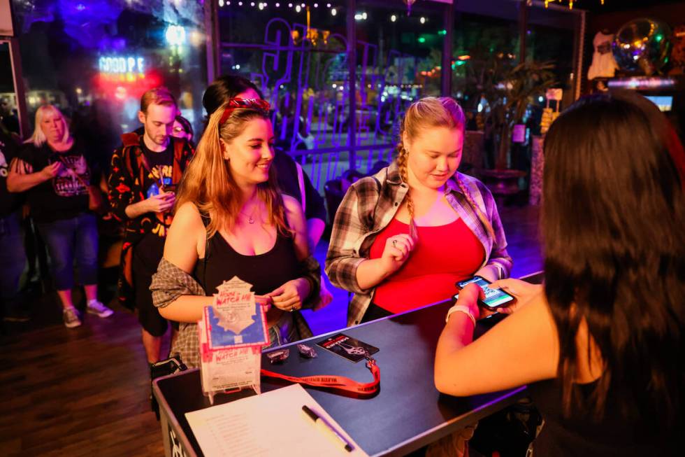 Jordan Smith, left, and Mackenzie Gabany check in at the front desk for a performance of &#x201 ...