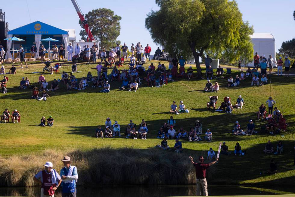 Golf fans watch the action at the 18th hole during the final round of the Shriners Children&#x2 ...