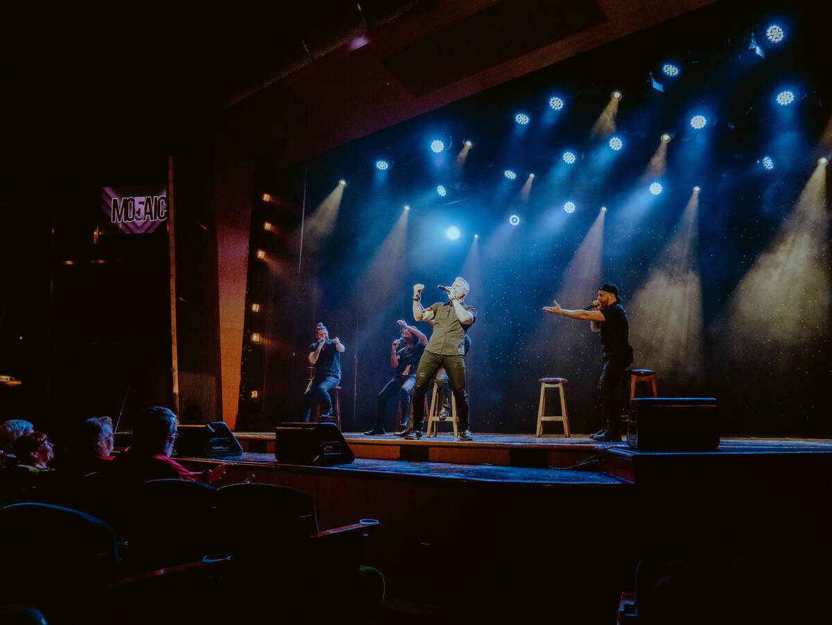 Heath Burgett of is shown at the front of Mo5aic in an undated performance. The vocal band's Ve ...