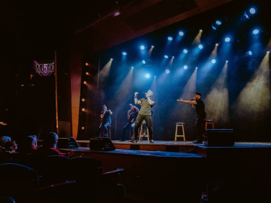 Heath Burgett of is shown at the front of Mo5aic in an undated performance. The vocal band's Ve ...