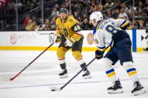 Golden Knights center Tomas Hertl (48) watches St. Louis Blues left wing Pavel Buchnevich (89) ...