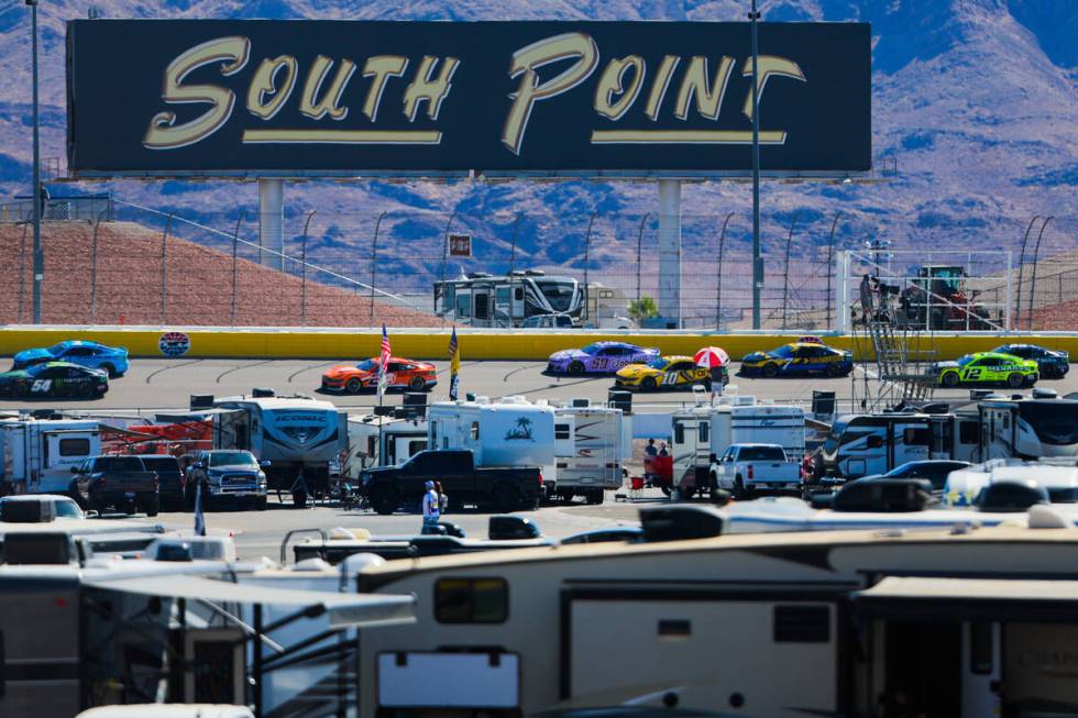 NASCAR drivers speed through the backstretch during the South Point 400 NASCAR Cup Series race ...