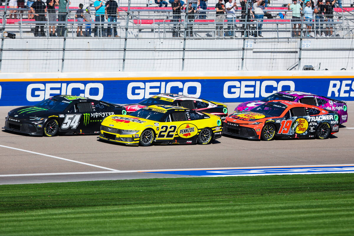 NASCAR drivers speed through the backstretch during the South Point 400 NASCAR Cup Series race ...