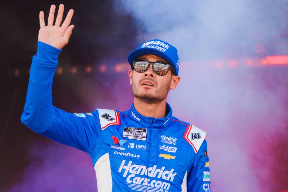 NASCAR driver Kyle Larson waves to fans during the South Point 400 NASCAR Cup Series race at th ...