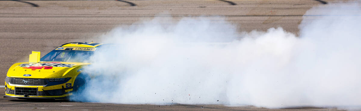 NASCAR driver Joey Logano celebrates winning the South Point 400 NASCAR Cup Series race at the ...