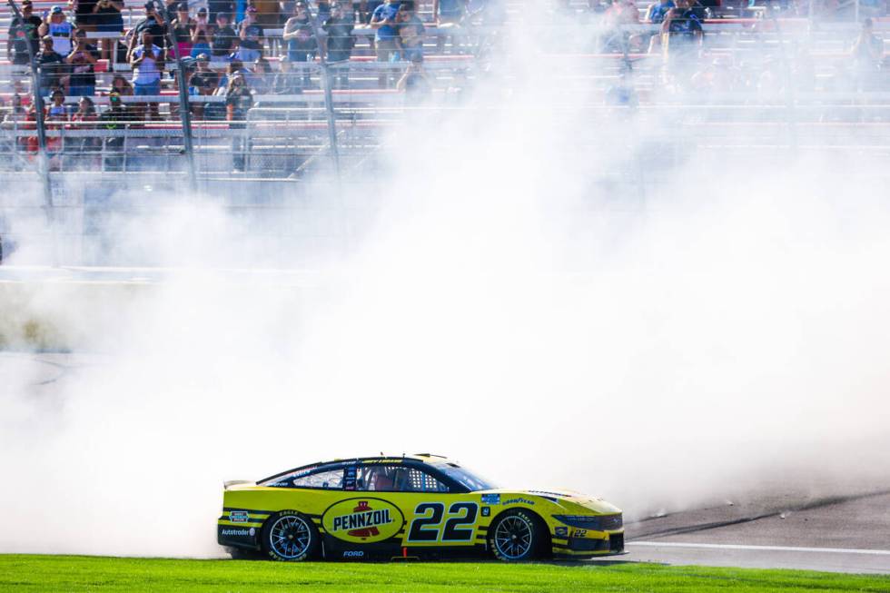 NASCAR driver Joey Logano celebrates winning the South Point 400 NASCAR Cup Series race at the ...