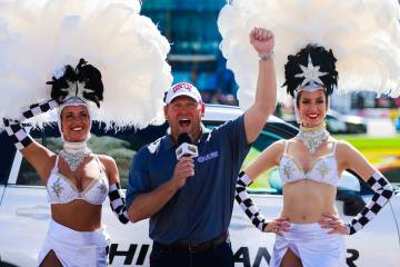 UNLV head football coach Barry Odom serves as grand marshal as he tells the drivers to start th ...