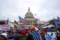 FILE - People attack the U.S. Capitol in Washington, on Jan. 6, 2021. (AP Photo/Jose Luis Magan ...