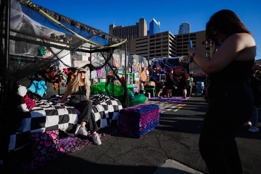 Festival attendees pose inside of a fake bedroom during the When We Were Young music festival a ...