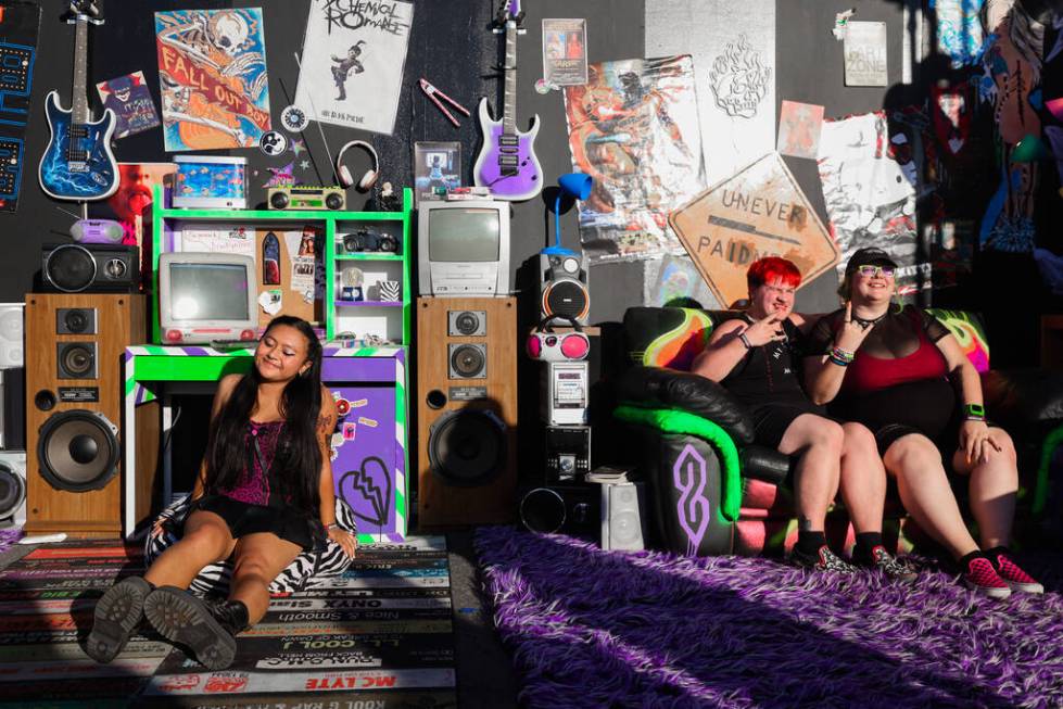 Festival attendees pose inside of a fake bedroom during the When We Were Young music festival a ...