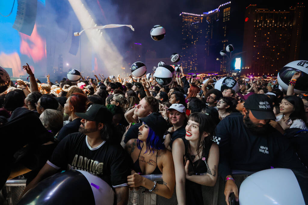 Beach balls float around during A Day To Remember’s set during the When We Were Young mu ...