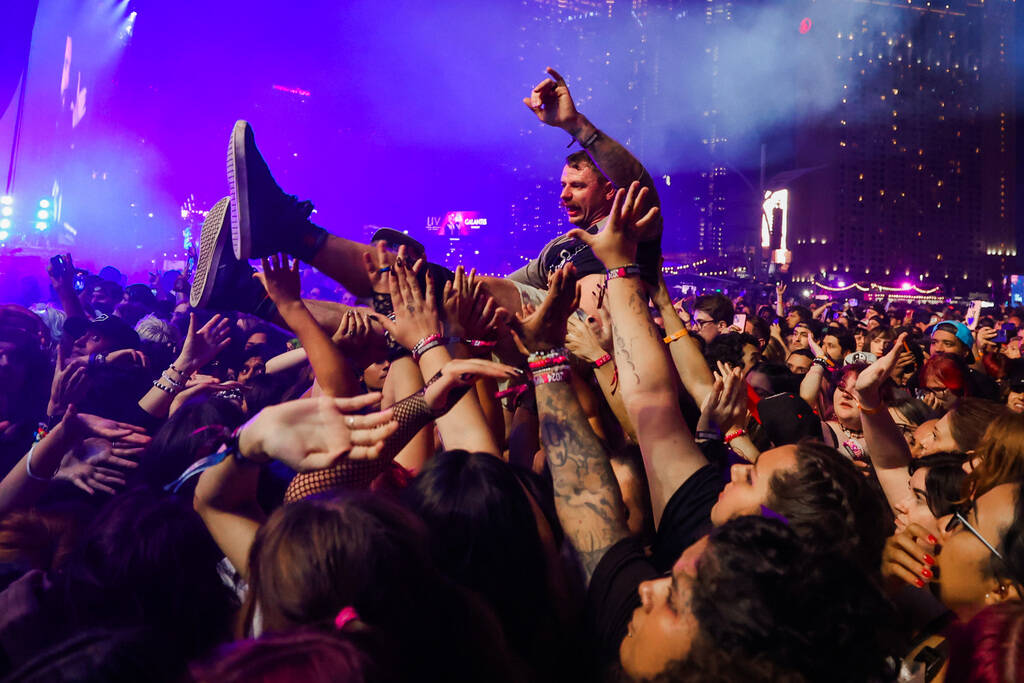 A festival attendee crowd surfs during A Day To Remember’s set at the When We Were Young ...