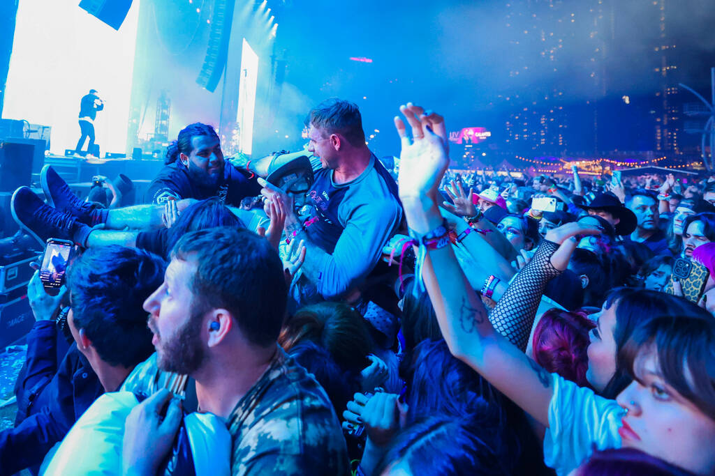 A festival attendee crowd surfs during A Day To Remember’s set at the When We Were Young ...