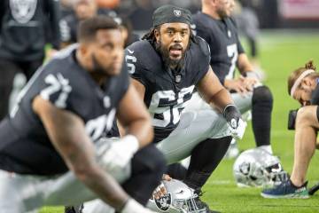 Raiders guard Dylan Parham (66) stretches before an NFL game against the Los Angeles Chargers a ...