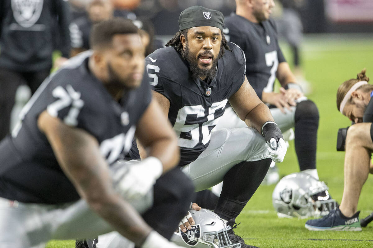 Raiders guard Dylan Parham (66) stretches before an NFL game against the Los Angeles Chargers a ...