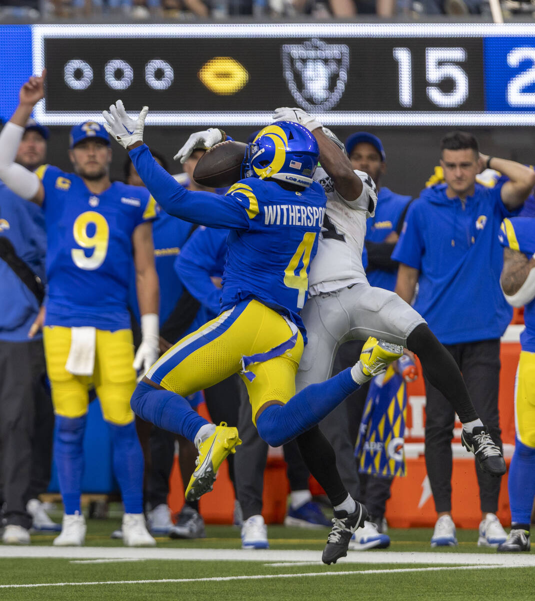 Raiders wide receiver DJ Turner (19) fights for a football against Los Angeles Rams cornerback ...