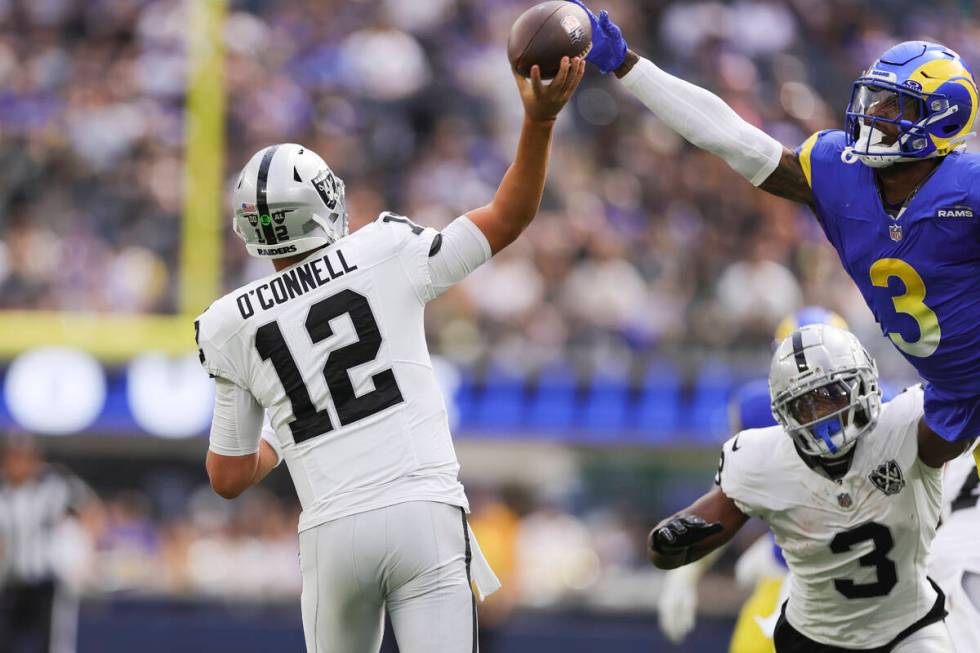 Las Vegas Raiders quarterback Aidan O'Connell (12) attempts to throw a pass as Los Angeles Rams ...