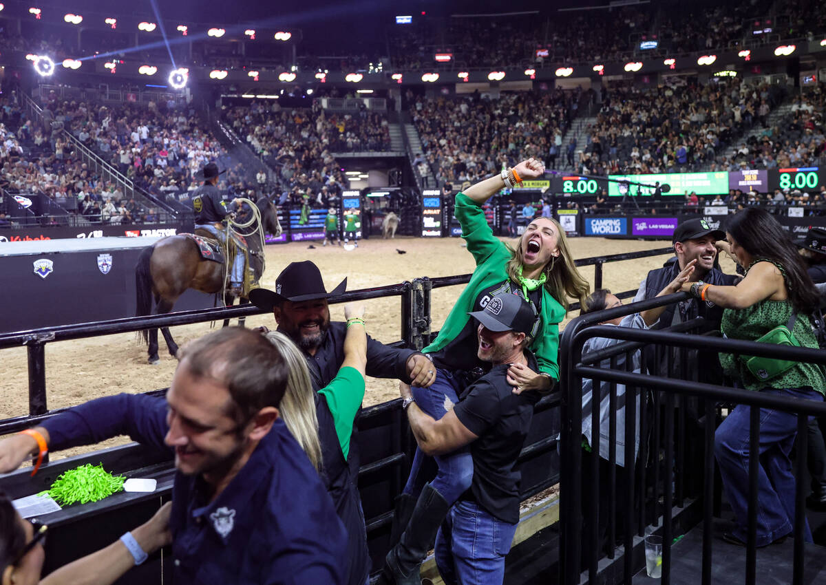 Fans of the Austin Gamblers cheer after rider Jose Vitor Leme earned a high score at the Profes ...