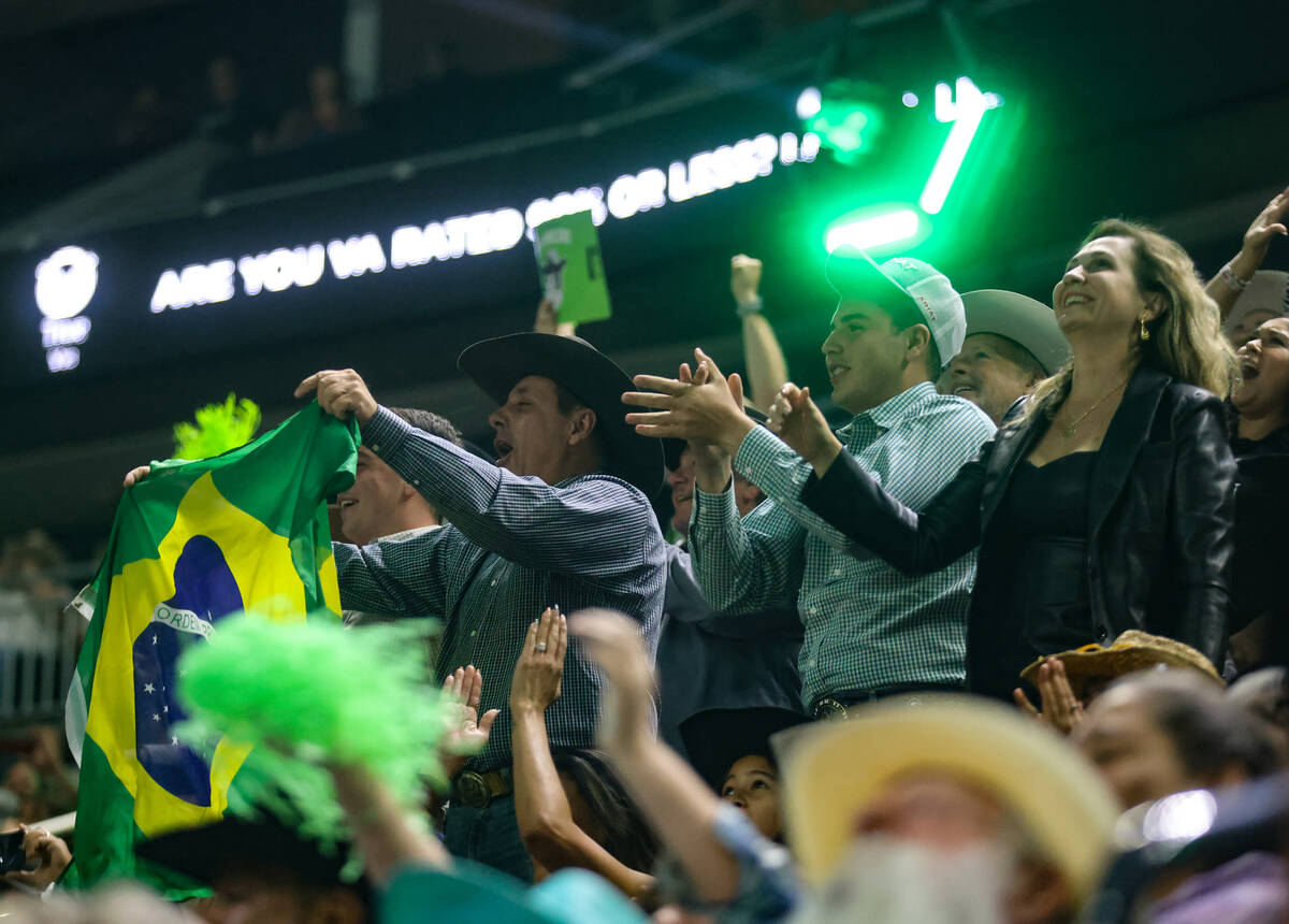 Fans of Jose Vitor Leme, who is from Brazil originally, cheer after he scored high enough to se ...