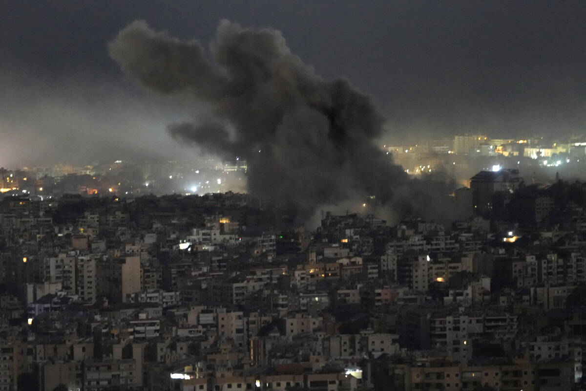 Smoke rises from an Israeli airstrike on Dahiyeh, in the southern suburb of Beirut, Lebanon, Su ...