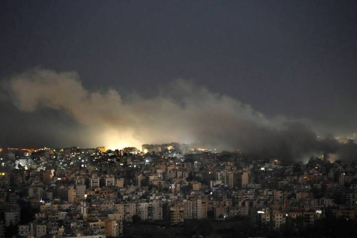 Smoke rises from an Israeli airstrike on Dahiyeh, in the southern suburb of Beirut, Lebanon, Su ...