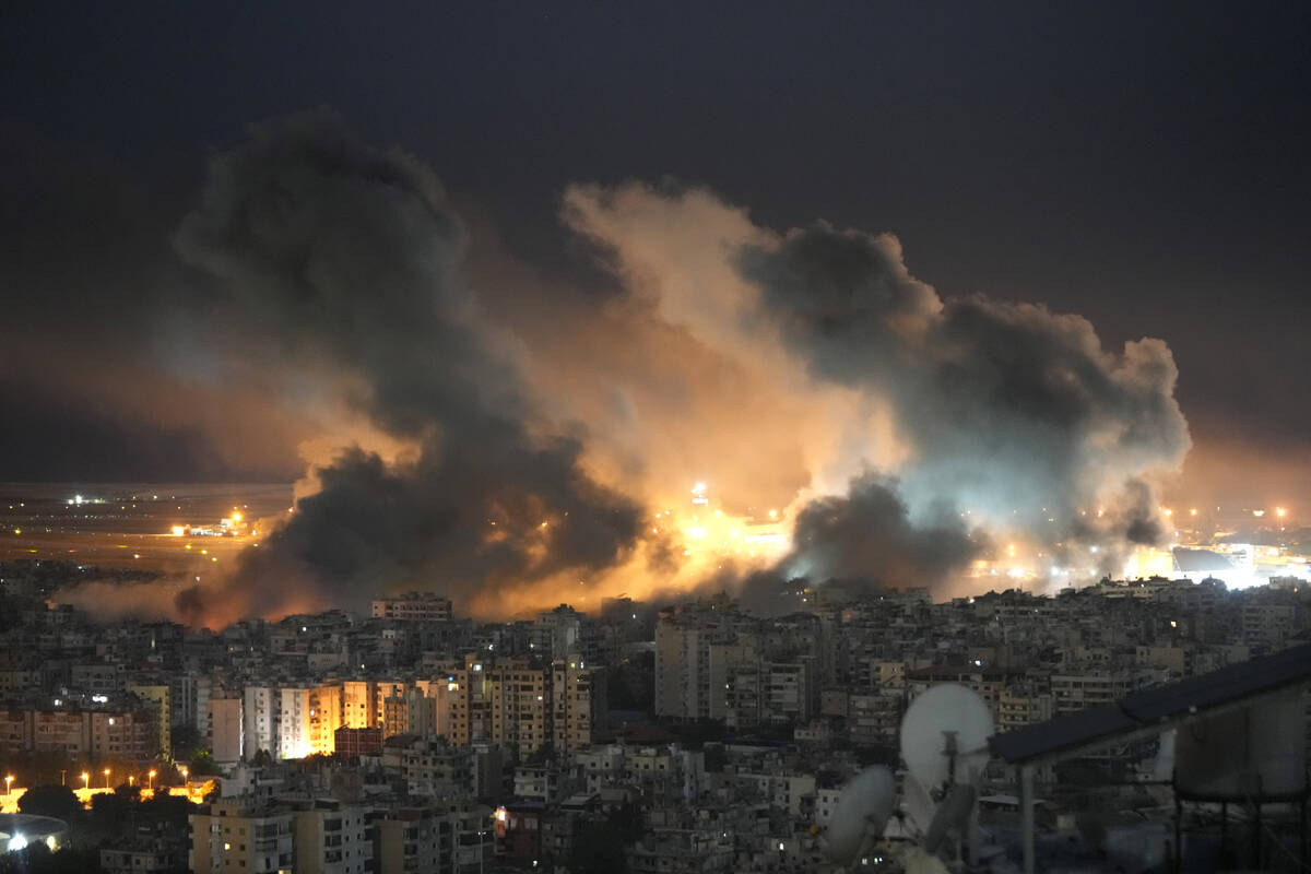 Flames and smoke rise form Israeli airstrikes on Dahiyeh, in the southern suburb of Beirut, Leb ...