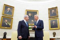 FILE - President Joe Biden, right, talks with Israeli Prime Minister Benjamin Netanyahu, left, ...