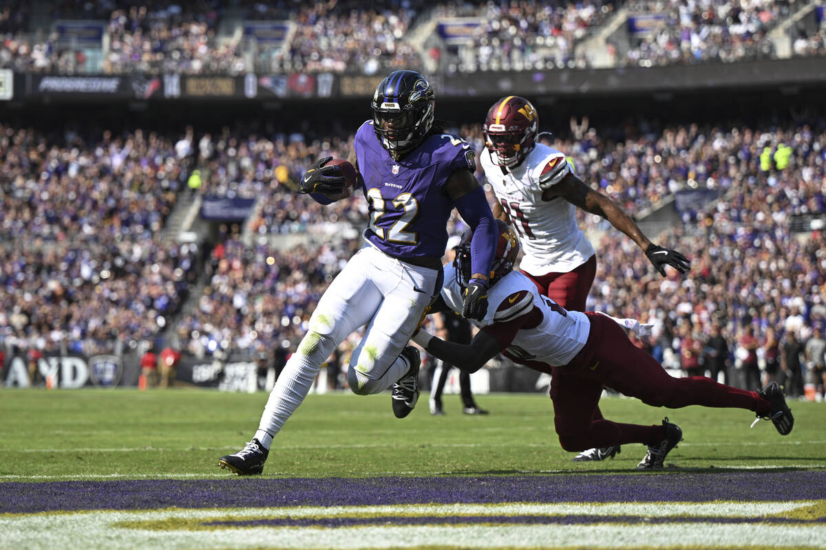 Baltimore Ravens running back Derrick Henry (22) runs the ball for a touchdown as Washington Co ...