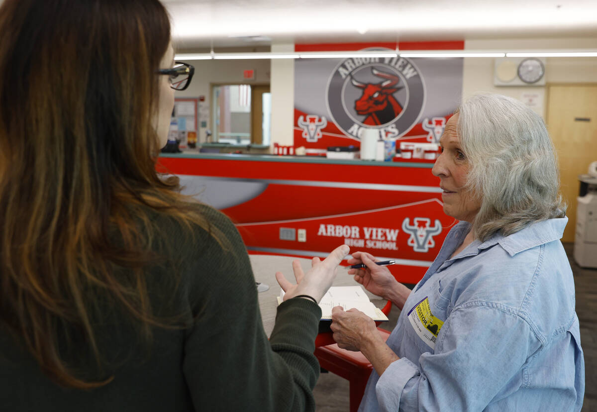 Ellen Hopkins, right, a banned author, chats with Nicole Adarme, English teacher at Arbor View ...