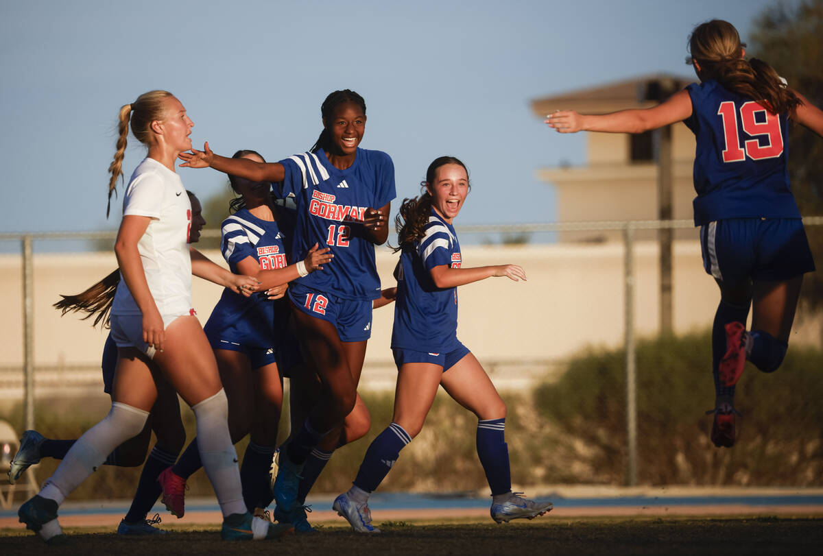 Bishop Gorman midfielder Amiya Warner (12) celebrates her goal against Coronado with teammates ...