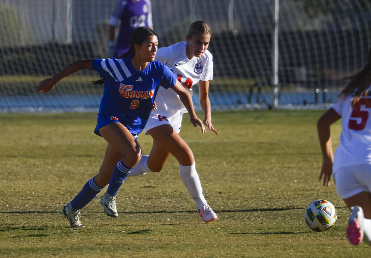 Bishop Gorman’s Alana Moore (9) and Coronado’s Allison Kleiner (14) go after the ...