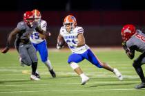 Bishop Gorman running back Jonathan Coar (21) runs the ball during the high school football gam ...