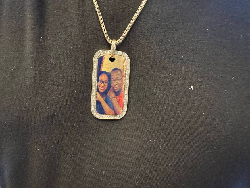 Bobby Brown's dogtag necklace, a photo of the R&B star with his late daughter Bobbi Kristina Br ...