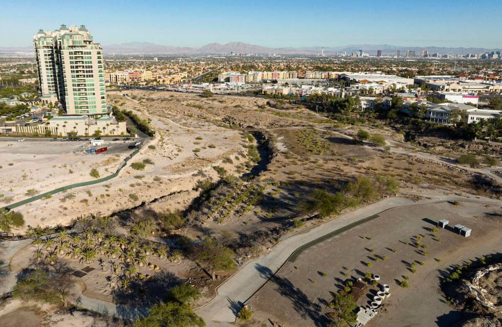 An aerial view of the shuttered Badlands Golf Course and the Queensridge towers, left, on Tuesd ...