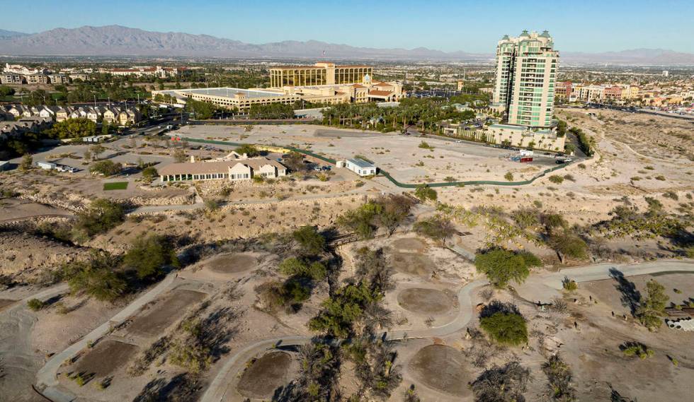 An aerial view of the shuttered Badlands Golf Course and the Queensridge towers, right, on Tues ...