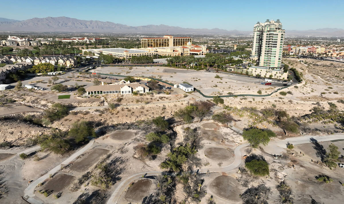 An aerial view of the shuttered Badlands Golf Course and the Queensridge towers, right, on Tues ...